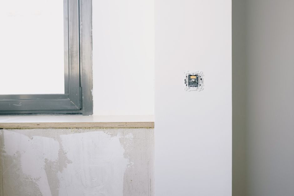 White wall beside a window in a bright room